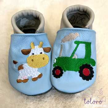 Name mit Kuh und Traktor