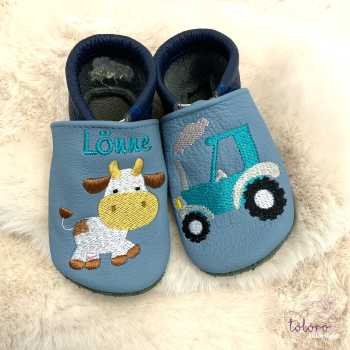 Name mit Kuh und Traktor