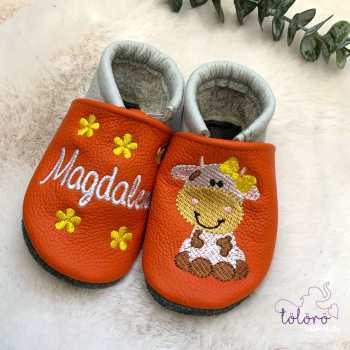 Name mit Blümchen und Kuhmädchen