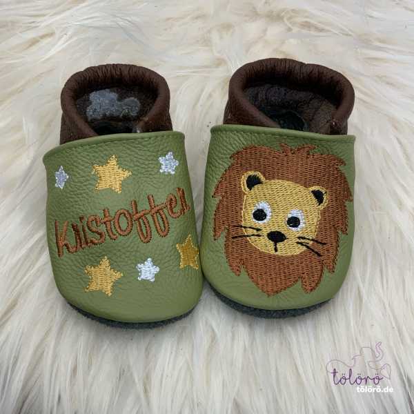 Name mit Sternen und Löwenkopf