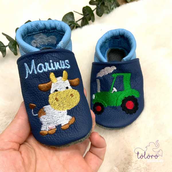 Name mit Kuh und Traktor