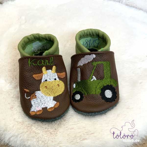 Name mit Kuh und Traktor